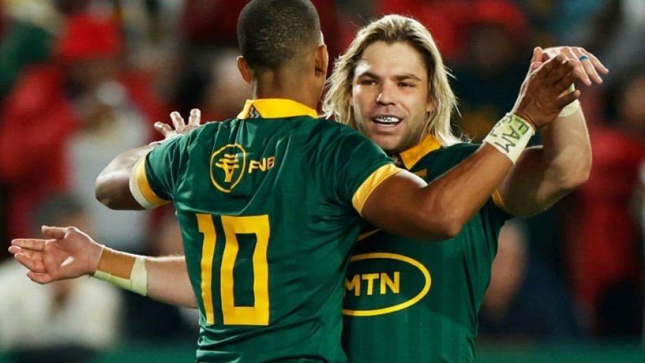 Celebrate: South Africa fly-half Manie Libbok (left) celebrates with scrum-half Faf de Klerk 