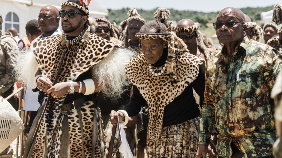 King of the Zulu nation, Misuzulu Zulu (L), traditional Prime Minister of the Zulu nation Prince Mangosuthu Buthelezi (C) and former South African President Jacob Zuma (R) attend the reenactment of the Battle of Isandlwana, in Isandlwana on January 21, 2023.