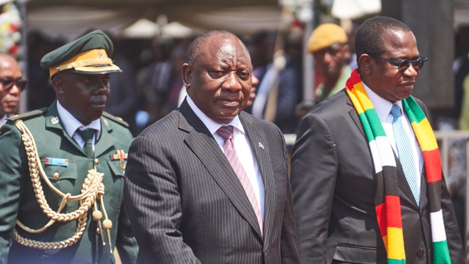 South African President Cyril Ramaphosa (C) arrives for Zimbabwean President Emmerson Mnangagwa's (unseen) inauguration ceremony in Harare on September 4, 2023. (Photo by Zinyange Auntony / AFP)