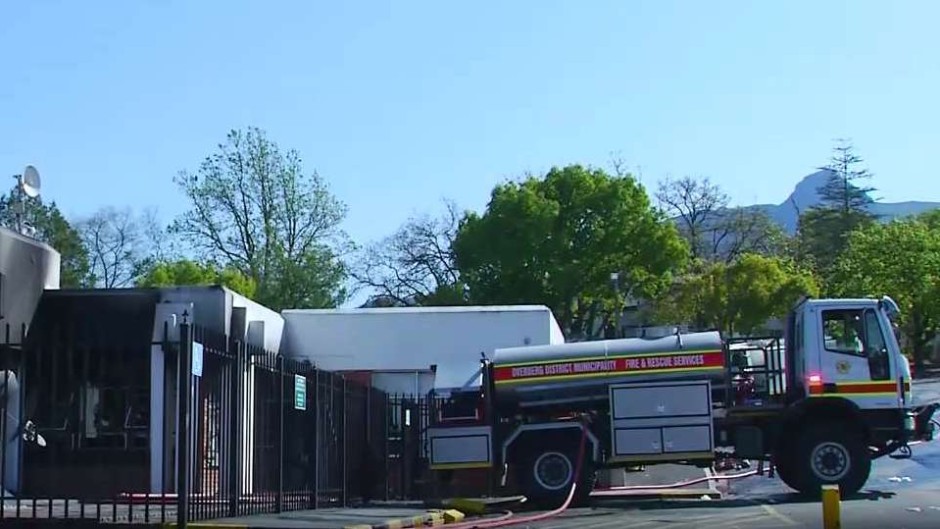 A firetruck next to a torched building in Swellendam.