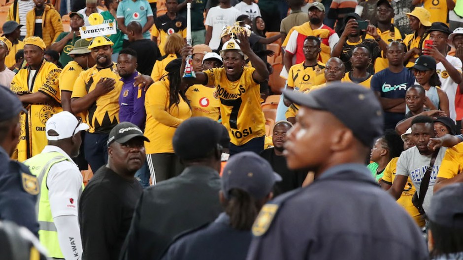 Fans react as police look on during the 2023 Carling Black Label Knockout match between Kaizer Chiefs and AmaZulu at the FNB Stadium. Muzi Ntombela/BackpagePix