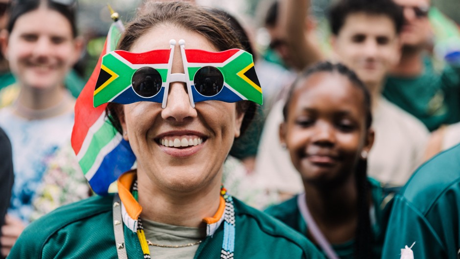 A springbok supporter wears glasses with the South African National Flag on them during the Springboks Champions trophy tour in Durban, on November 4, 2023, after South Africa won the France 2023 Rugby World Cup final match against New Zealand.