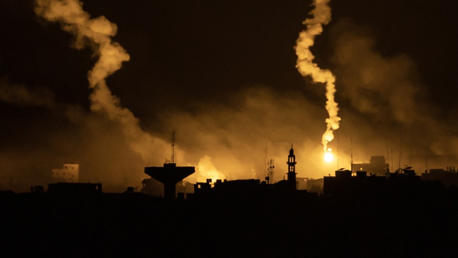 This picture taken from a position near Sderot along the Israeli border with the Gaza Strip early on November 13, 2023, shows flares dropped by Israeli forces above the Palestinian enclave amid ongoing battles between Israel and the Palestinian Hamas movement.