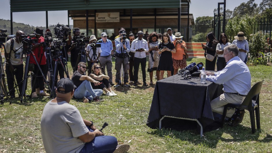 Rob Matthews (R), spokesperson for June Steenkamp, Reeva Steenkamp's mother, speaks to the media at the Atteridgeville Correctional Centre. AFP/Roberta Ciuccio