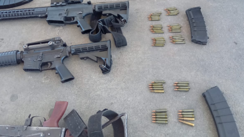 Firearms -- including scores of ammunition and magazines -- were seized. Twitter/@SAPoliceService