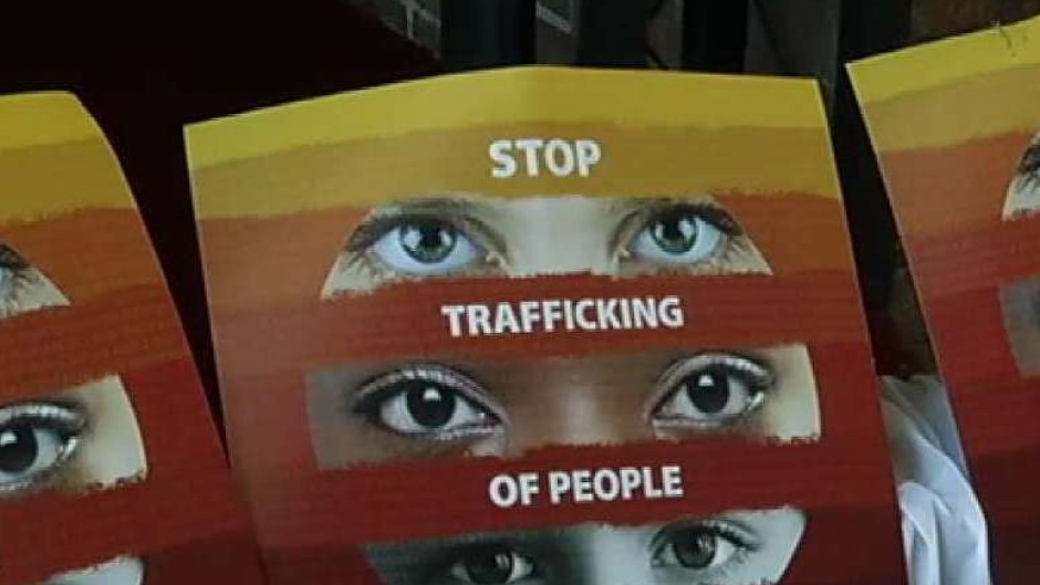 A sign urging people to stop human trafficking.