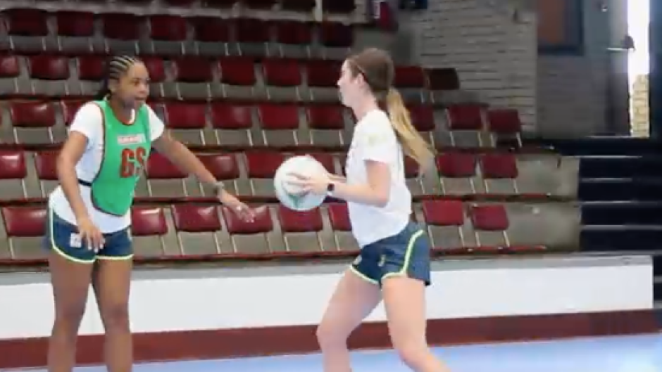 The netball players practicing.