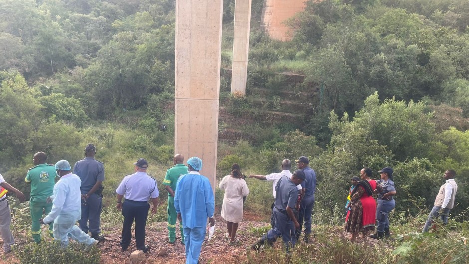 Onlookers and teams at the scene