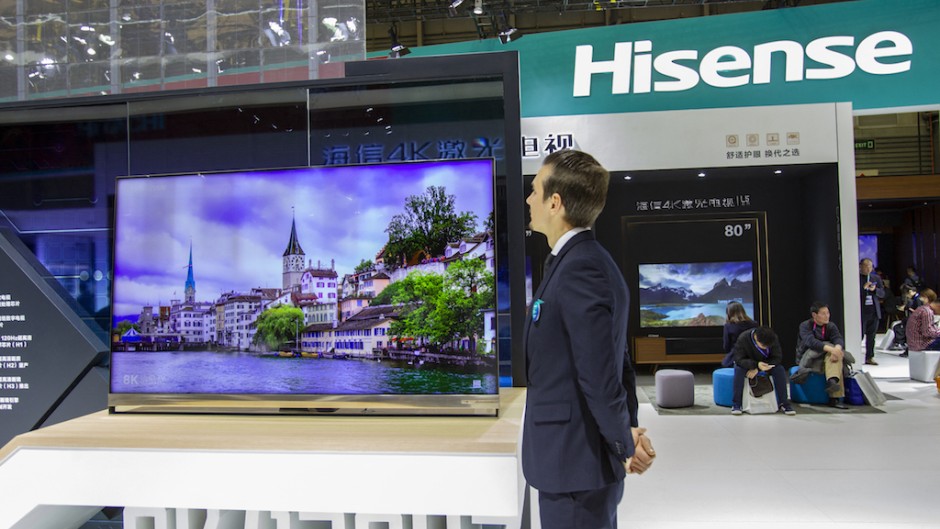 File: A vendor next to a Hisense TV. DYCJ/Imaginechina via AFP