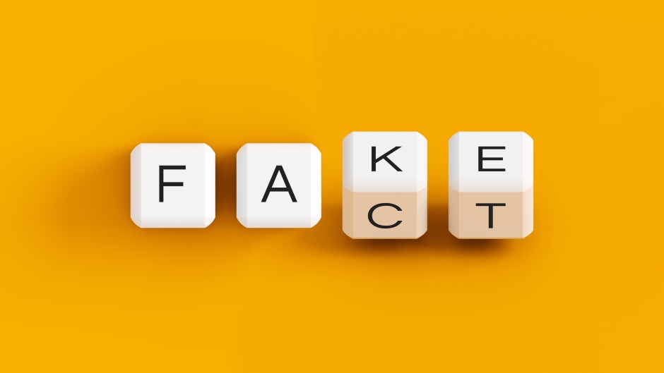 Fake news illustration, fake fact dice concept. Getty Images/Anton Melnyk