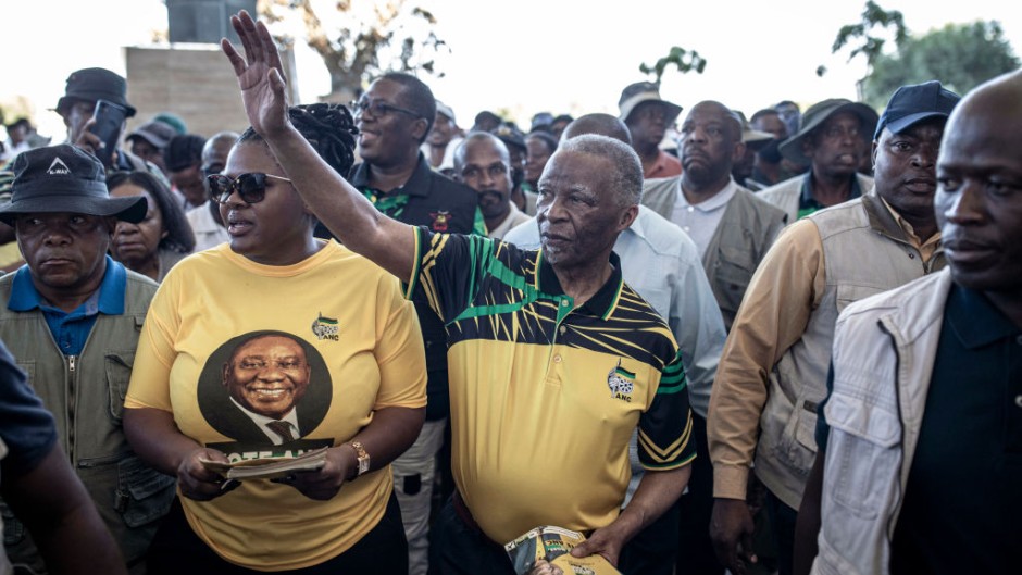 Former president Thabo Mbeki greets supporters as he arrives for an election campaign event. Per-Anders Pettersson/Getty Images