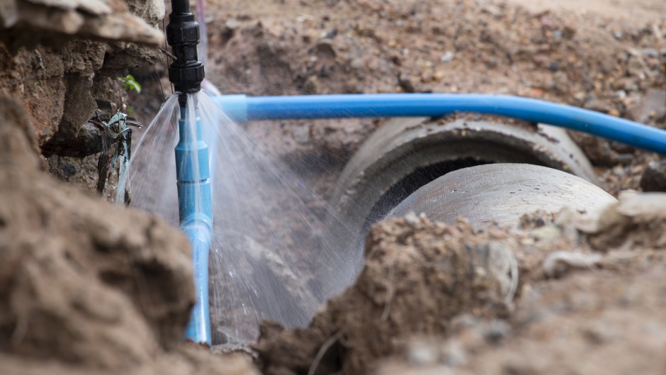 File: An exposed burst water pipe spraying water.GettyImages/24d8bd43_811