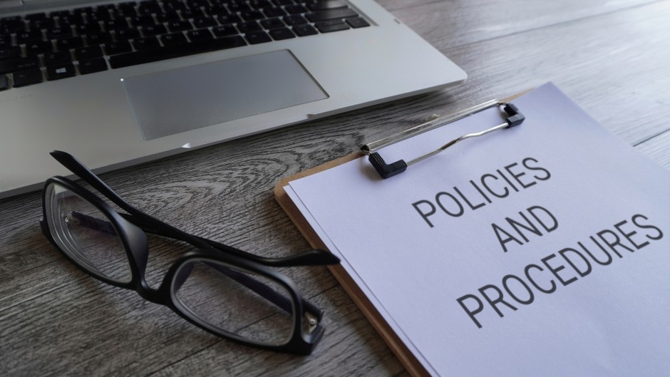 File: Paper clipboard reading Policies and Procedures on a desk. Getty Images/Mohd Izzuan