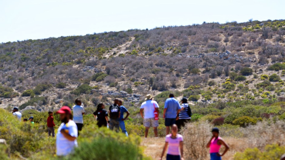 Members of the community search for Joslin Smith in the woods in Diazville. Theo Jeptha/Die Burger/ Gallo Images via Getty Images