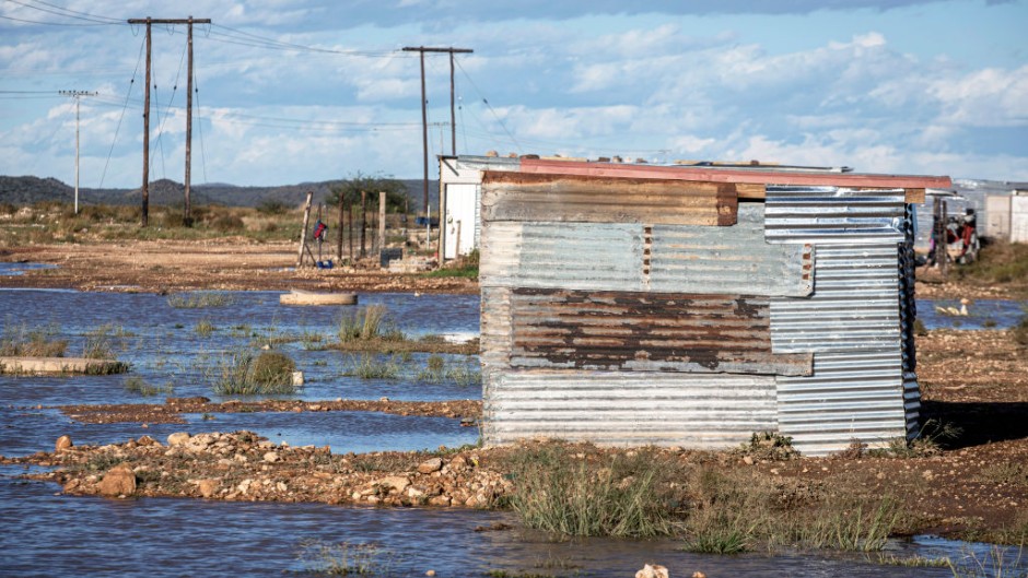 File: A flooded shack stands abandoned. Per-Anders Pettersson/Getty Images