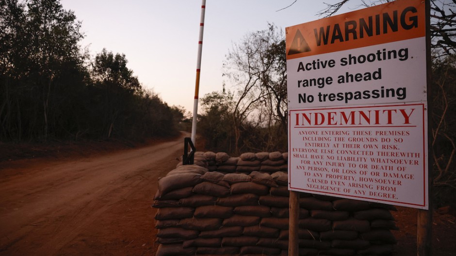 A warning sign at the entrance to a farm where the SAPS detained 95 Libyan nationals. AFP/Phill Magakoe