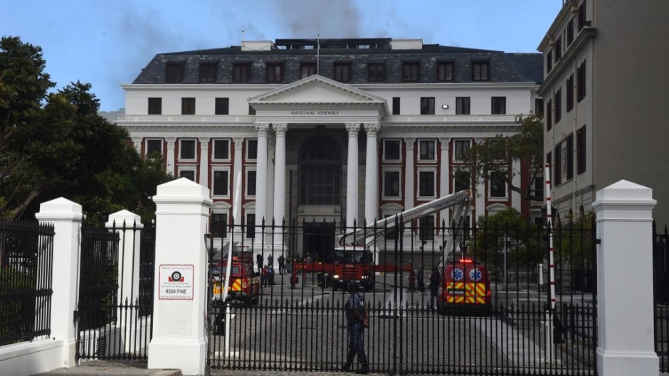 File: Firefighters extinguish the fire broke out at Parliament. Xabiso Mkhabela/Anadolu Agency via Getty Images