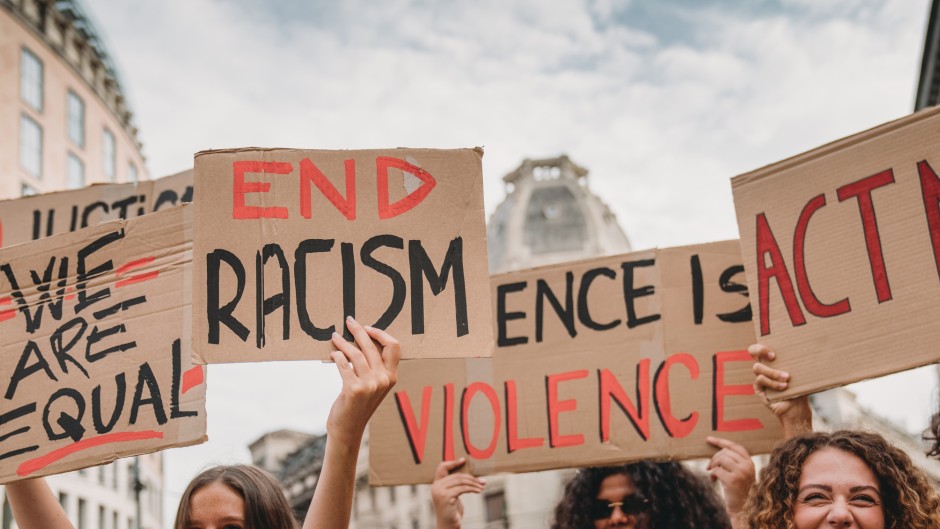 File: People marching against racism. GettyImages/FilippoBacci