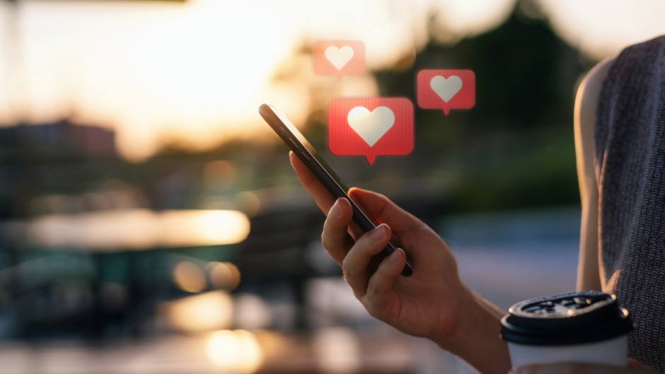 File: A person checking a dating app on a cellphone. Getty Images/d3sign