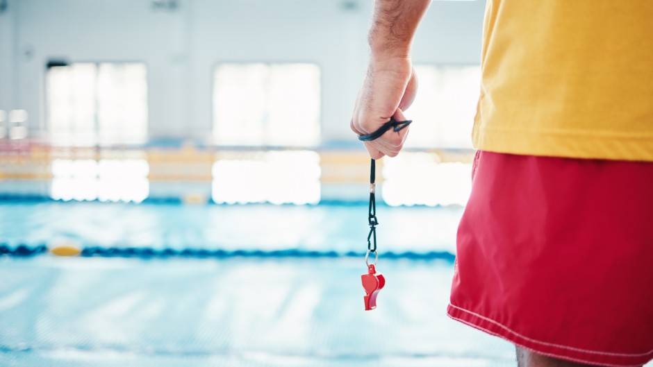 File: A lifeguard at a swimming pool. GettyImages/PeopleImages