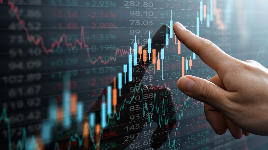 File: Candlestick chart and data of financial market. GettyImages/tadamichi