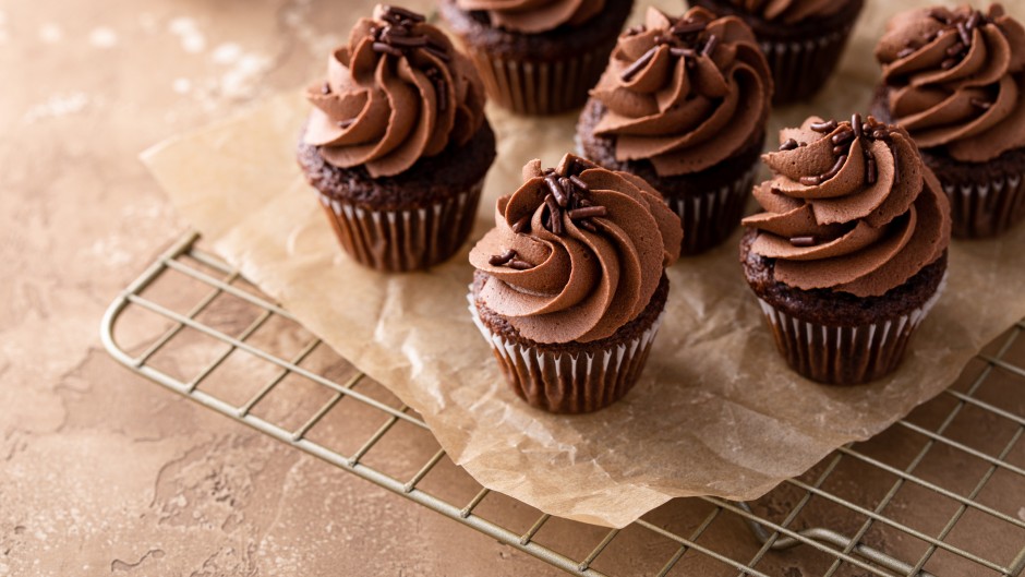 File: Dark chocolate cupcakes with chocolate ganache frosting. GettyImages/VeselovaElena