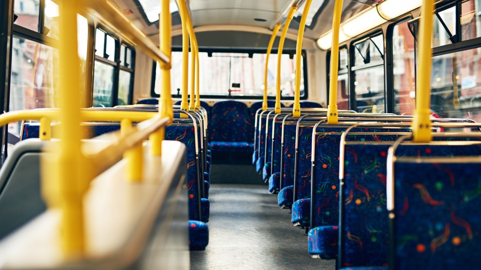 File: Seats on an empty bus. GettyImages/PeopleImages