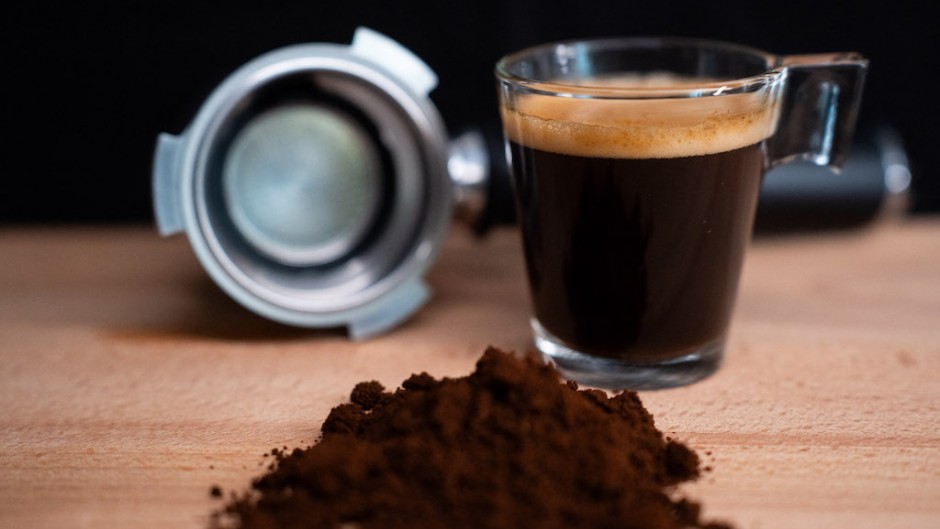 File: A glass of espresso coffee, a portafilter, and some coffee blend. Nikos Pekiaridis/NurPhoto via AFP