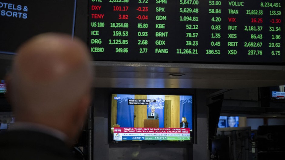 Traders on the floor of the New York Stock Exchange. AFP/Angela Weiss