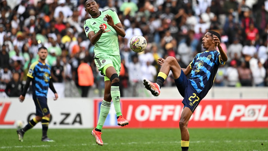 Taahir Goedeman of Cape Town City gets to the ball ahead of Thalente Mbatha of Orlando Pirates during the DStv Premiership 2023/24 Game at Cape Town Stadium 