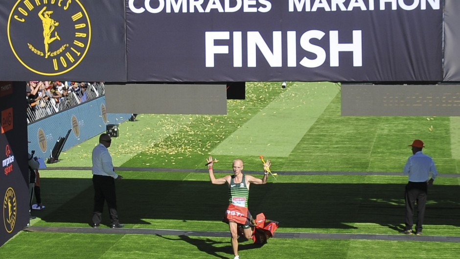 Piet Wiersma crosses the finish line of the 2024 Comrades Marathon. BackpagePix/Phakamisa Lensman