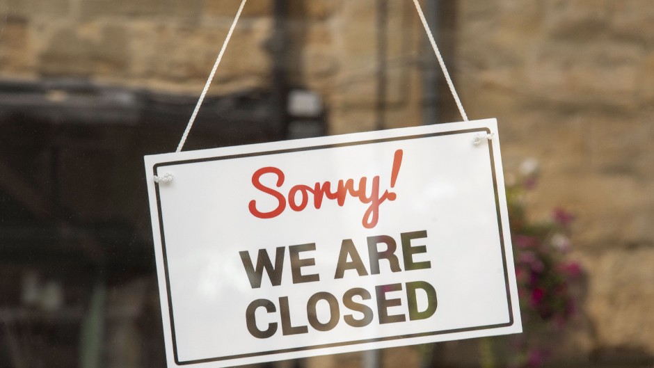 File: A closed sign in a shop window. Peter Titmuss/UCG via Getty Images