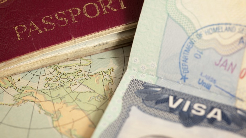 File: A passport and visa. GettyImages/belterz