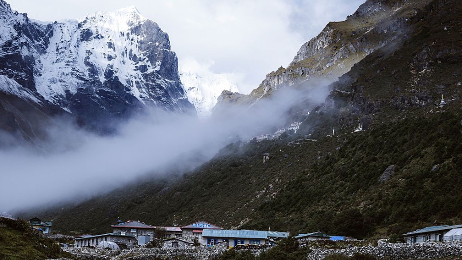 File: Early morning fog in the valley in Thame, Nepal. GettyImages/Heath Holden