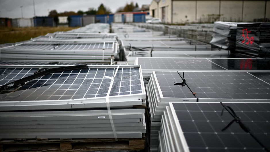 File: Piles of worn-out solar panels. AFP/Christophe Archambault