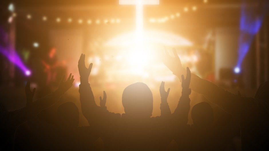 File: People listening to worship music. GettyImages/arkira