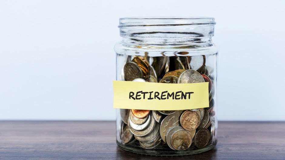 A bottle filled with coins for retirement. GettyImages/Nora Carol Photography