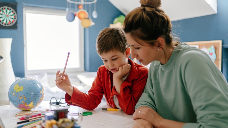 File: A young boy being homeschooled by his mother. GettyImages/AleksandarNakic