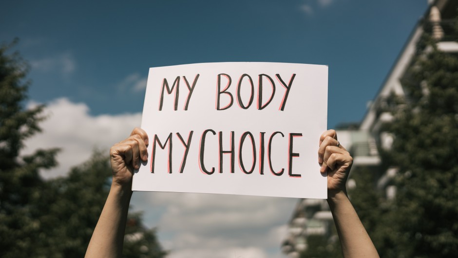 File: Woman holding a sign "My Body, My Choice. GettyImages/Amparo Garcia