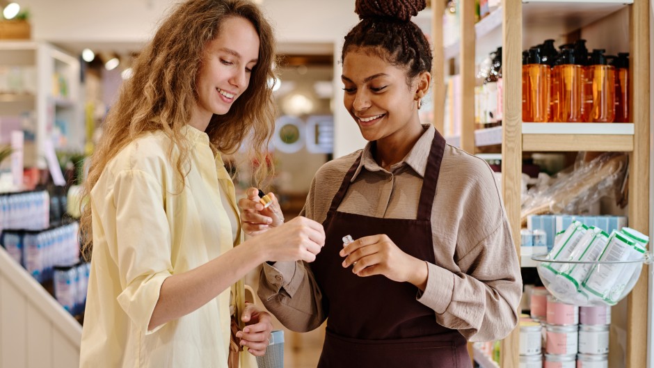 File: Saleswoman helping a customer in a cosmetics store. GettyImages/AnnaStills