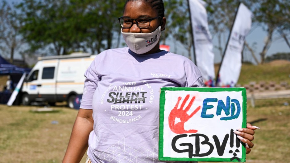 File: A student with End GBV sign at the 10th Annual Silent Protest March. Darren Stewart/Gallo Images via Getty Images