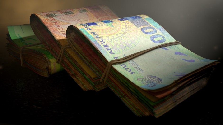 A close-up view of stacks of South African rand banknotes. GettyImages/allanswart