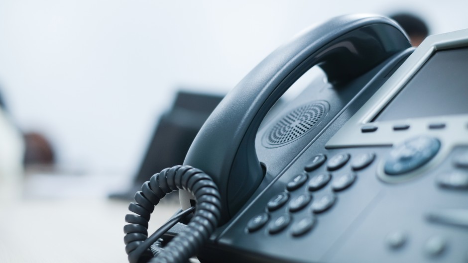 File: A telephone seen on a desk. GettyImages/Chainarong Prasertthai