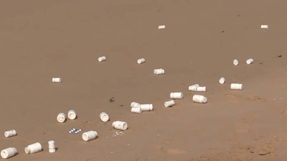 Some of the pill bottles that washed up on the beach. eNCA