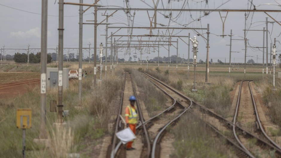 A worker prepares to signal on the train tracks on the central corridor rail freight line. Guillem Sartorio/Bloomberg via Getty Images