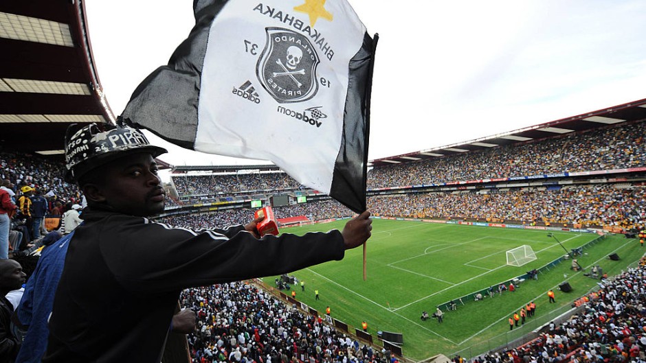 File: A fan waving an Orlando Pirates flag. Lefty Shivambu/Gallo Images/Getty Images