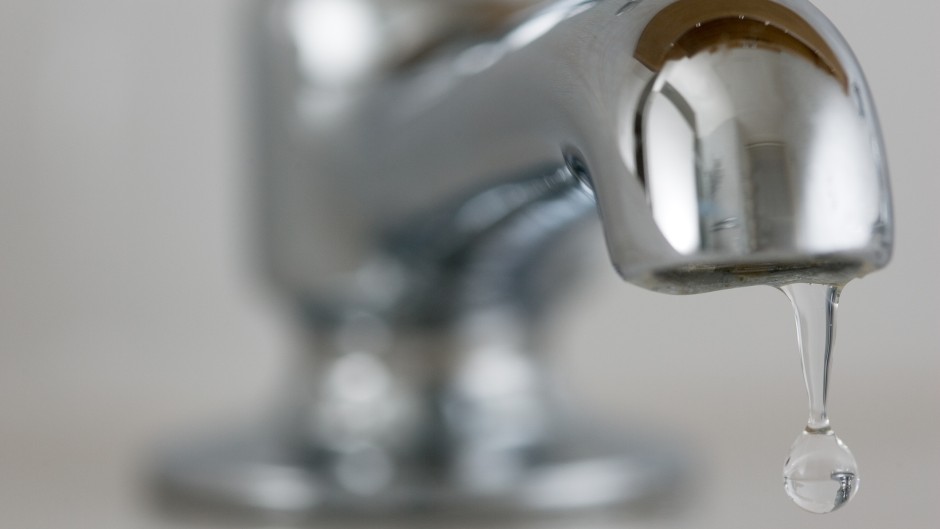 File: Water drips from a tap. GettyImages/Tim Graham