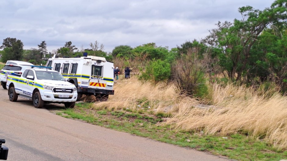 Police officers waiting for the illegal miners to resurface. eNCA/Bafedile Moerane