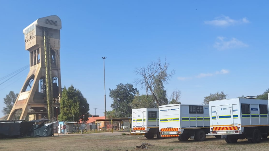 Police trucks at the mine in Orkney. eNCA/Bafedile Moerane