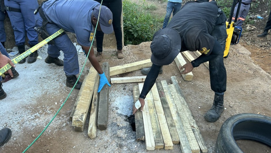 Police officers at an abandoned mine in Sabie. eNCA/Pule Letshwiti-Jones